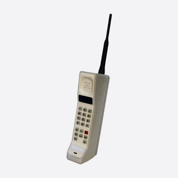 A vintage brick mobile phone, representing the contact section
